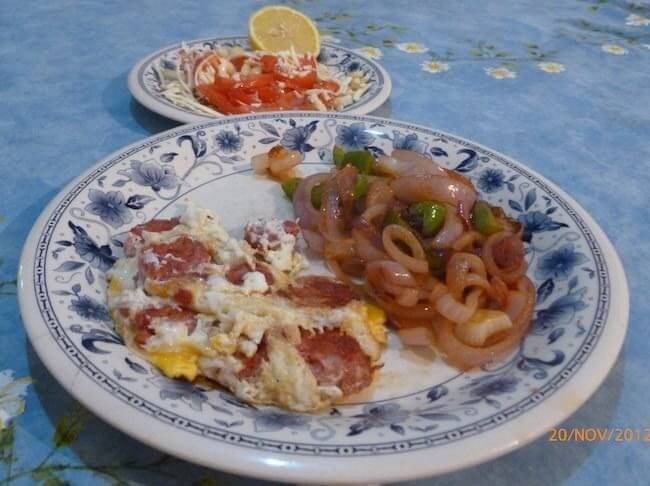 chorizo tortilla with onion, corn and tomato salad